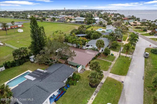 an aerial view of a houses with outdoor space and river view