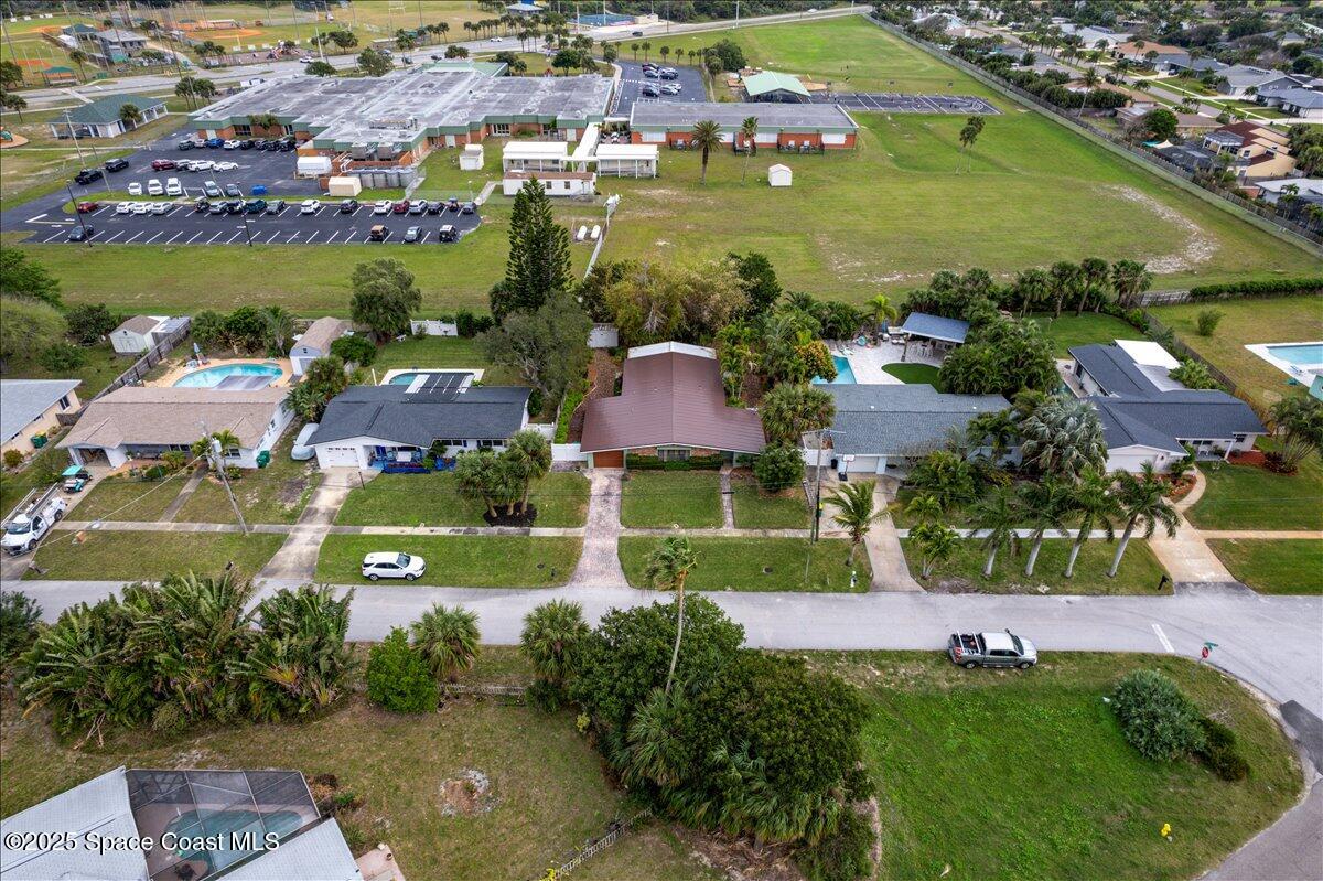 2175 Barracuda Avenue Melbourne Beach, FL 32951 - Photo 48 of 49 an aerial view of residential houses with outdoor space and lake view