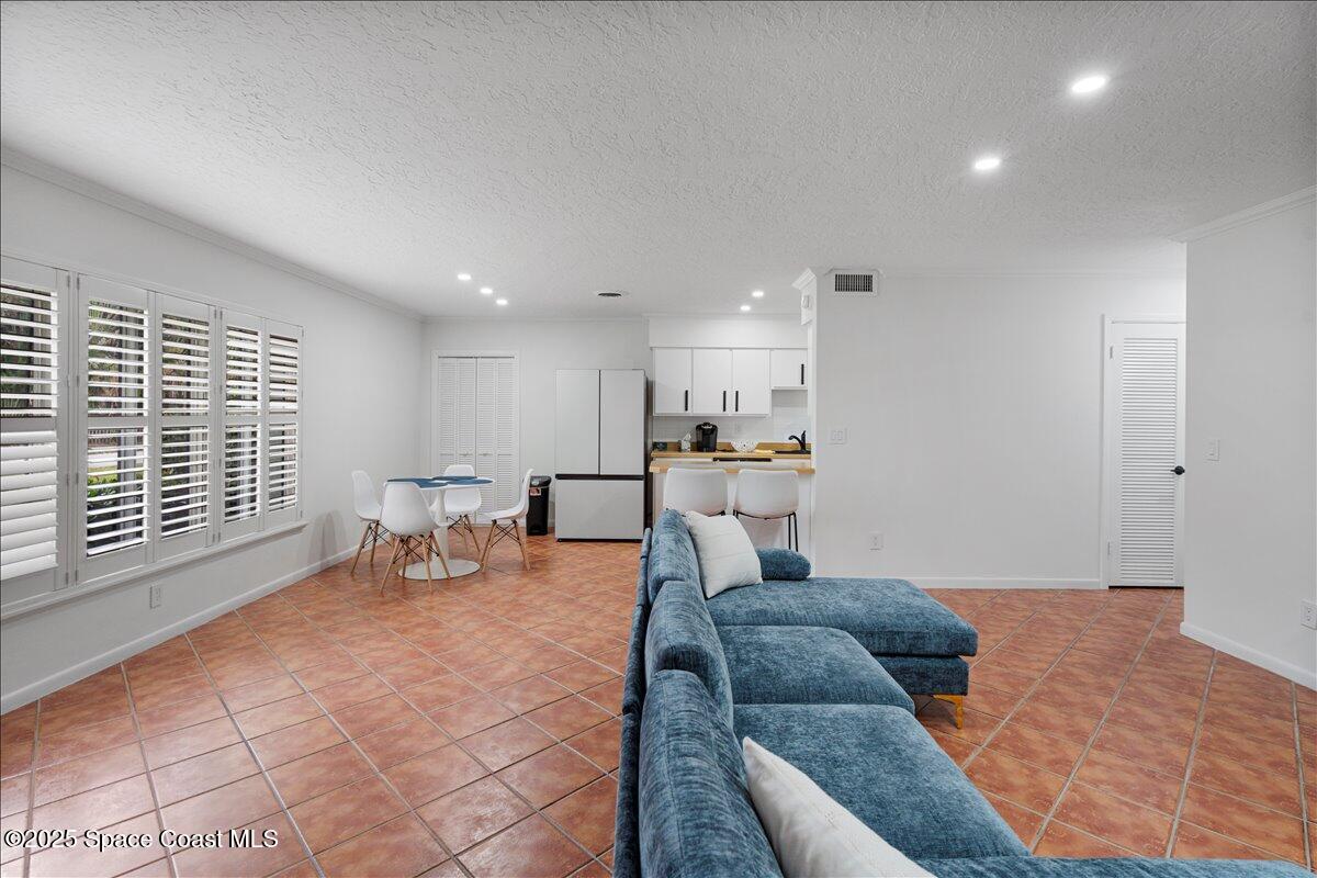 2175 Barracuda Avenue Melbourne Beach, FL 32951 - Photo 5 of 49 a living room with furniture window and kitchen view