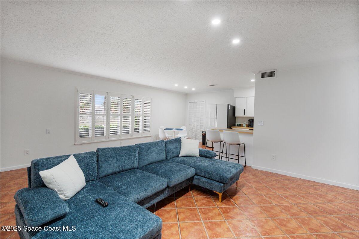 2175 Barracuda Avenue Melbourne Beach, FL 32951 - Photo 6 of 49 a living room with furniture and a window
