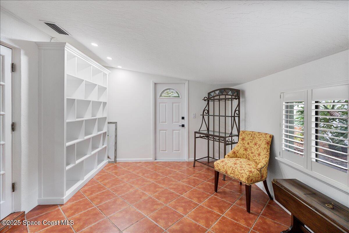 2175 Barracuda Avenue Melbourne Beach, FL 32951 - Photo 8 of 49 a bedroom with a bed and a window