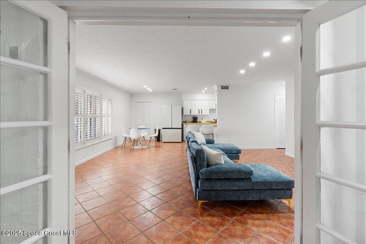 2175 Barracuda Avenue Melbourne Beach, FL 32951 - Photo 10 of 49 a living room with furniture and a table