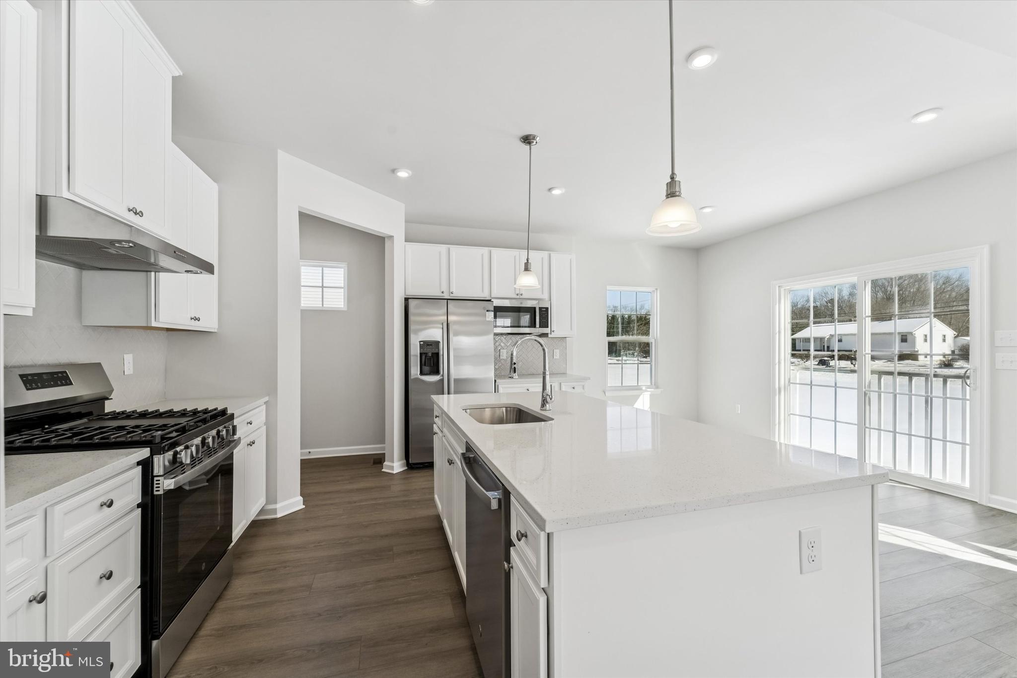 56 Mockernut Road Williamstown, NJ 08094 - Photo 6 of 29 a kitchen with stainless steel appliances granite countertop a sink stove and refrigerator