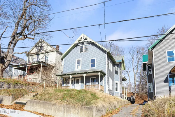a view of a house with snow on the wall