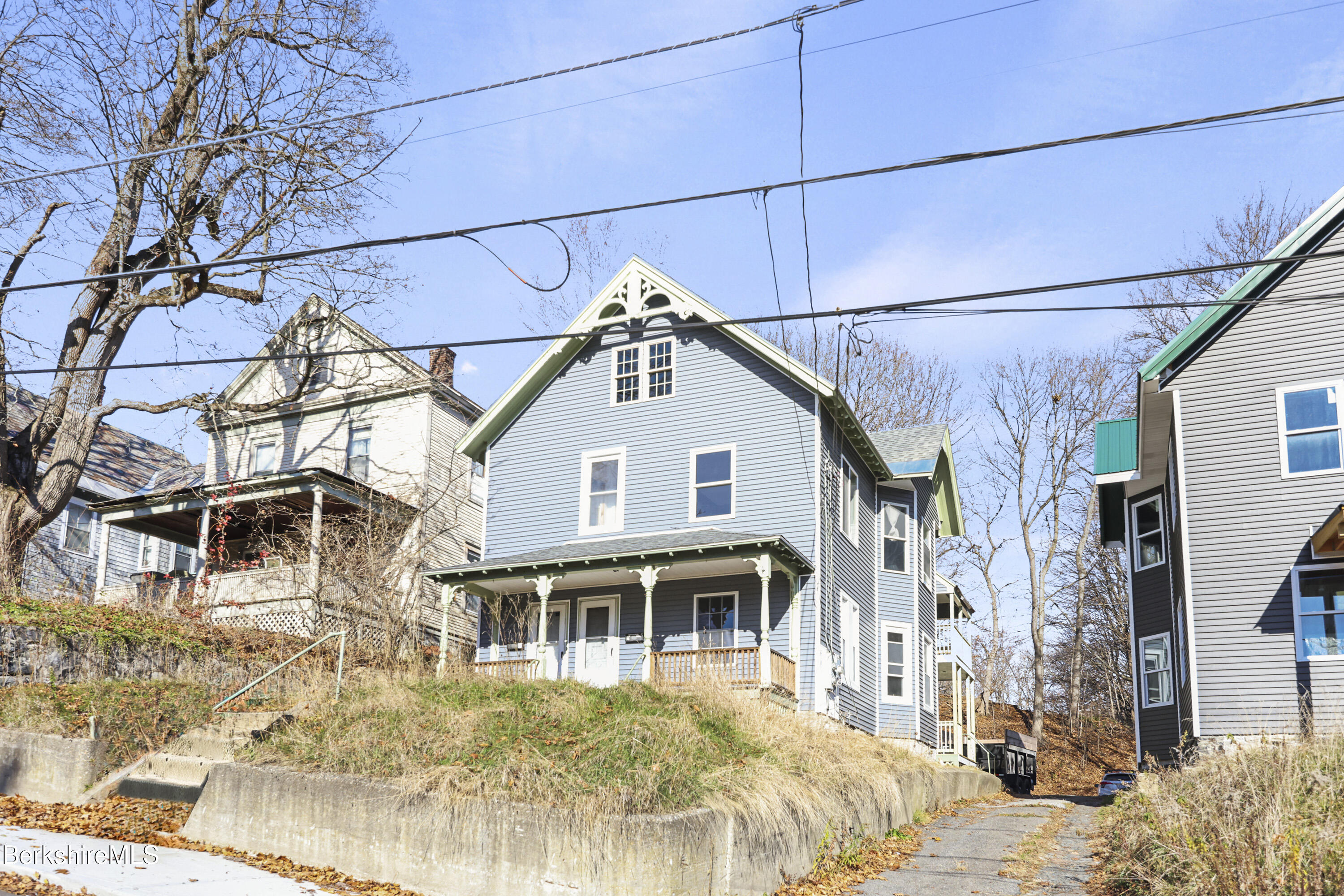 a view of a house with snow on the wall