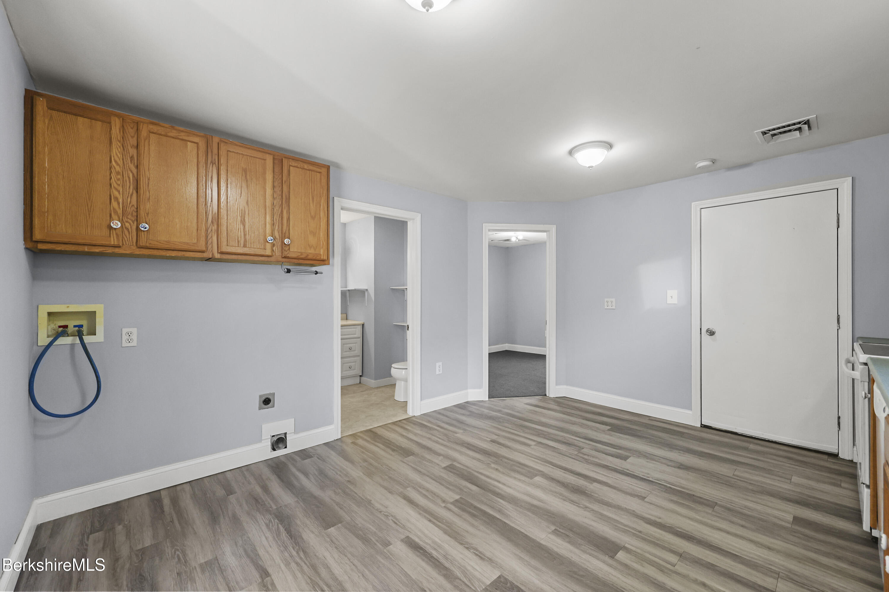 73-75 Hall Street North Adams, MA 01247 - Photo 16 of 32 a view of a room with wooden floor and cabinets