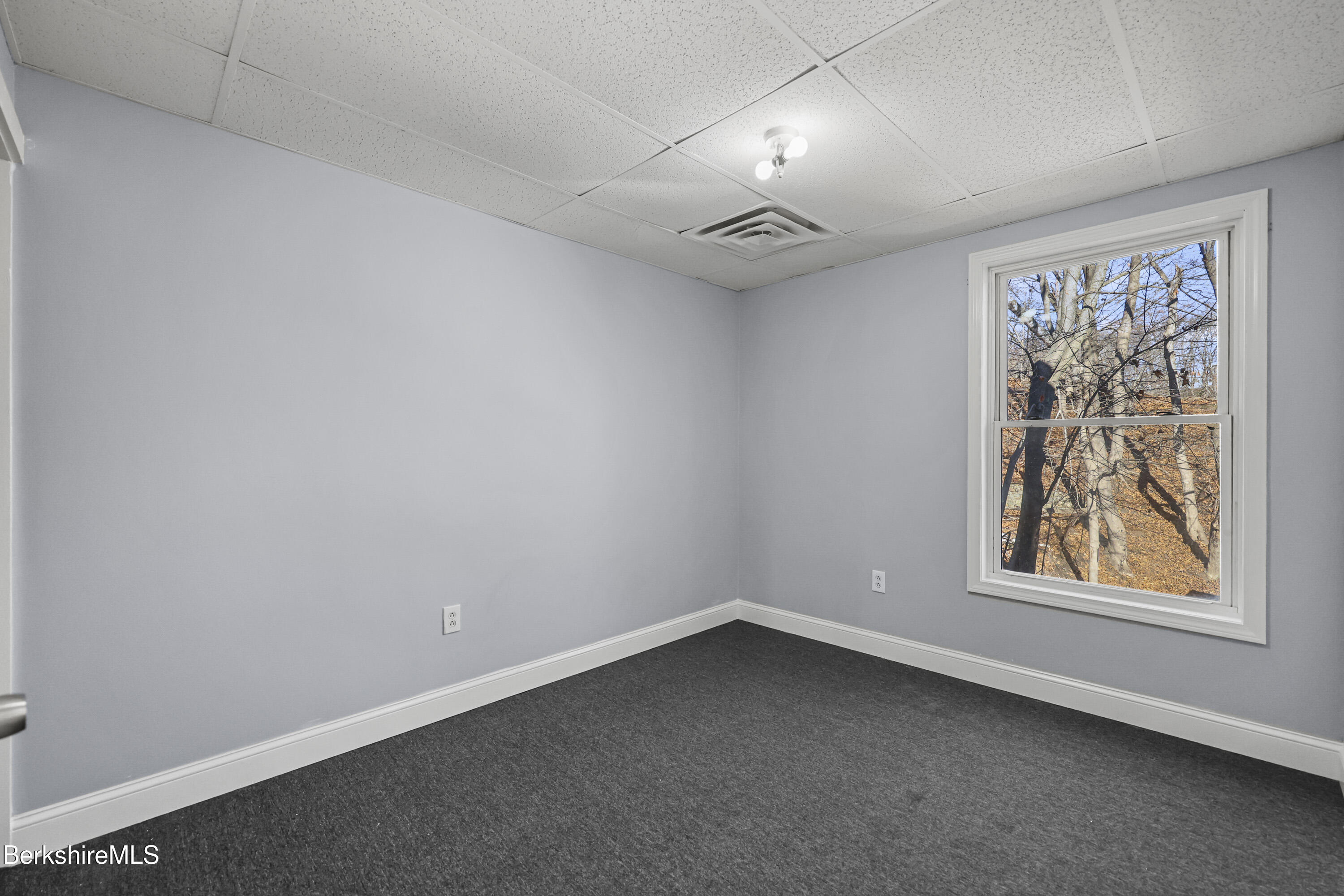73-75 Hall Street North Adams, MA 01247 - Photo 17 of 32 an empty room with a window