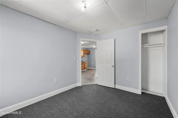 an empty room with entrance door