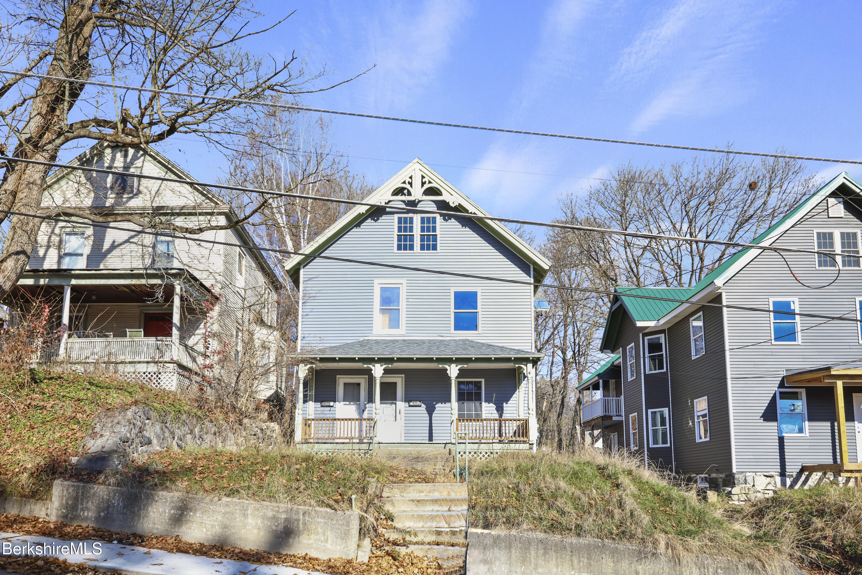 73-75 Hall Street North Adams, MA 01247 - Photo 2 of 32 a front view of a house with a yard