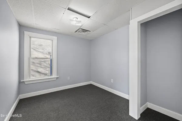 a view of a balcony with wooden floor
