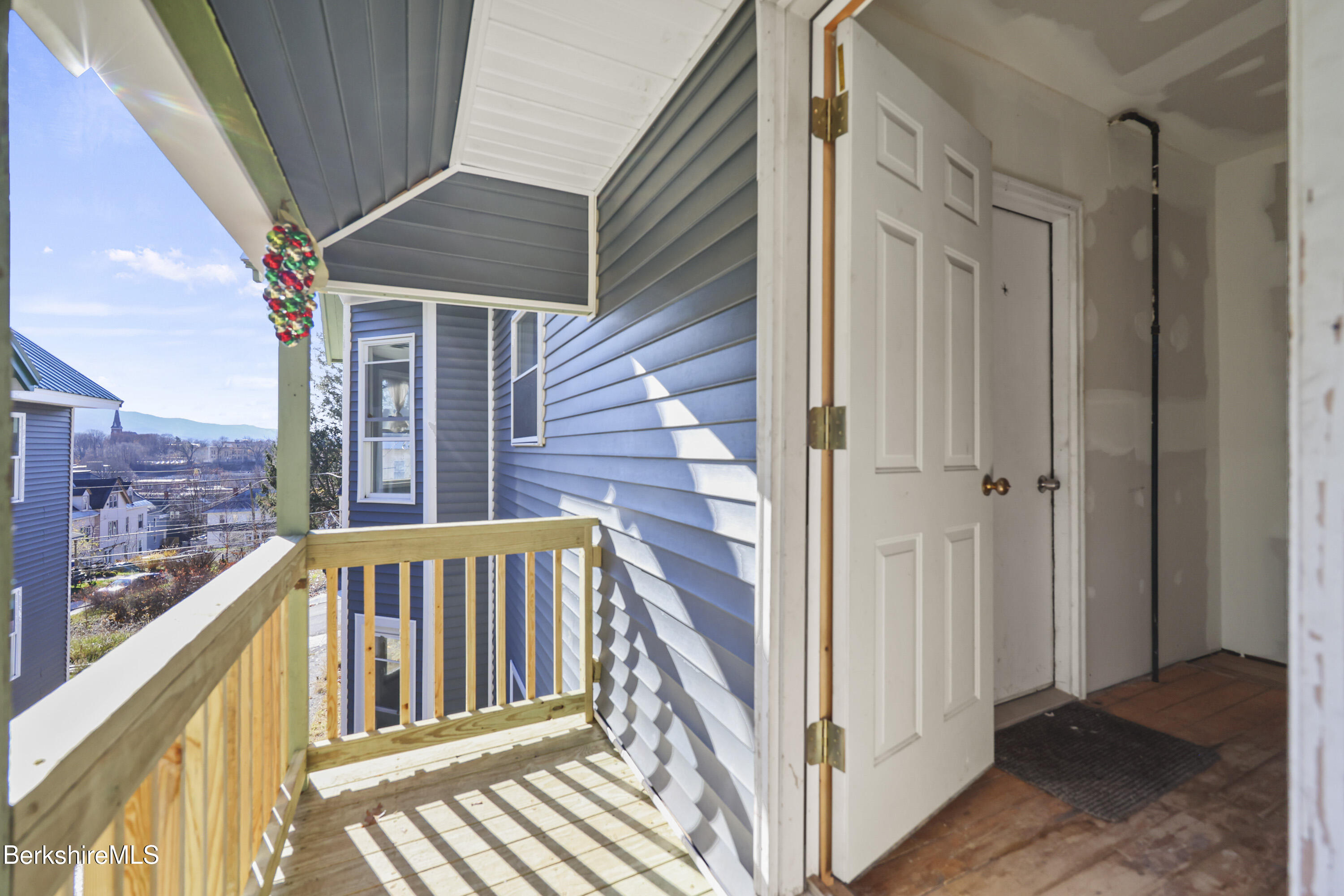 73-75 Hall Street North Adams, MA 01247 - Photo 23 of 32 a view of a balcony with wooden floor