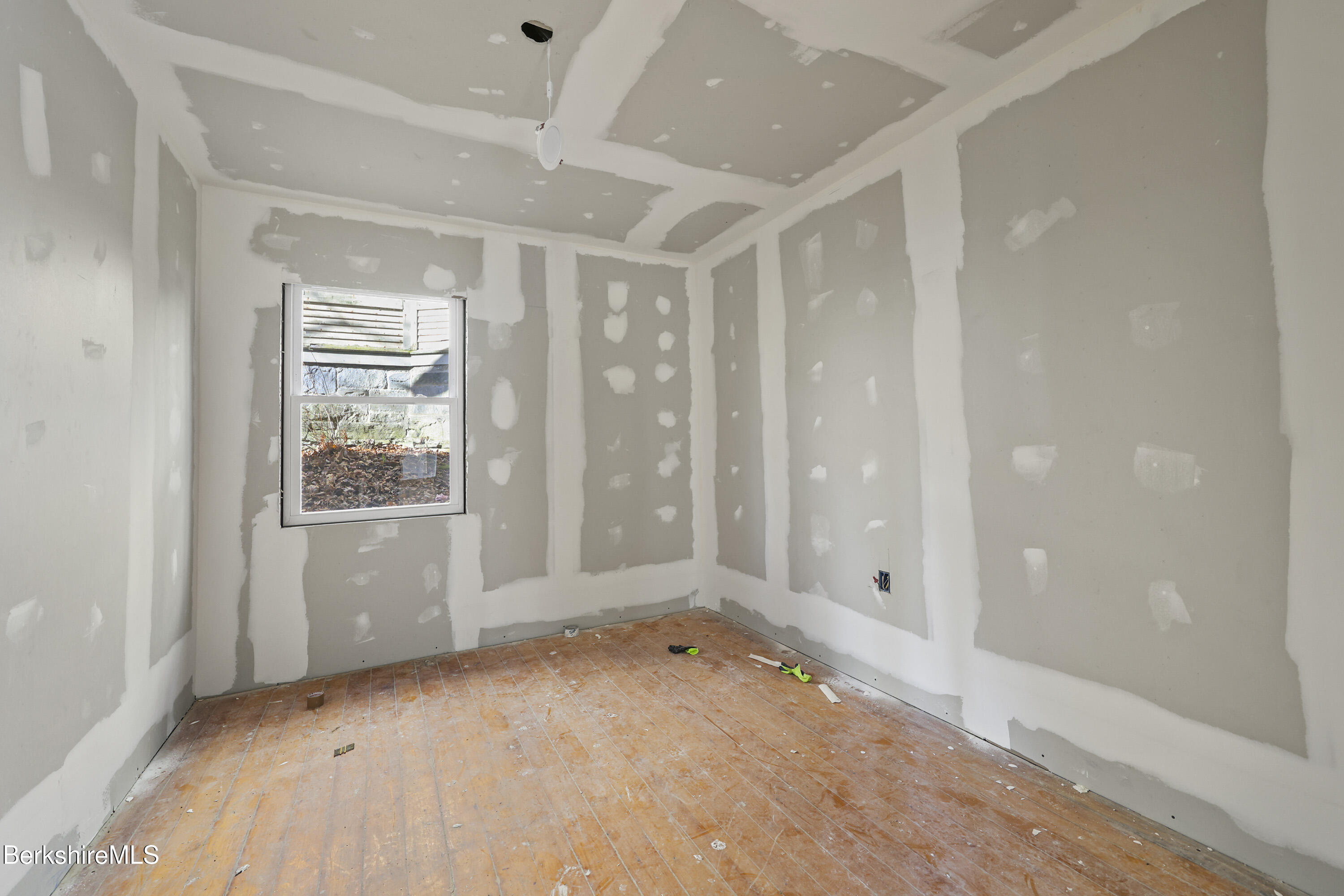 73-75 Hall Street North Adams, MA 01247 - Photo 31 of 32 an empty room with windows and closet