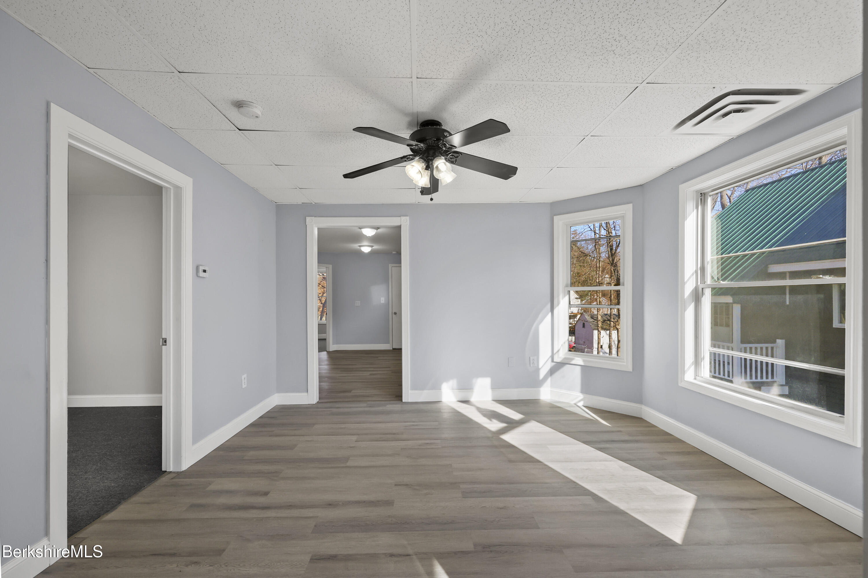73-75 Hall Street North Adams, MA 01247 - Photo 7 of 32 a view of a livingroom with a chandelier fan and windows