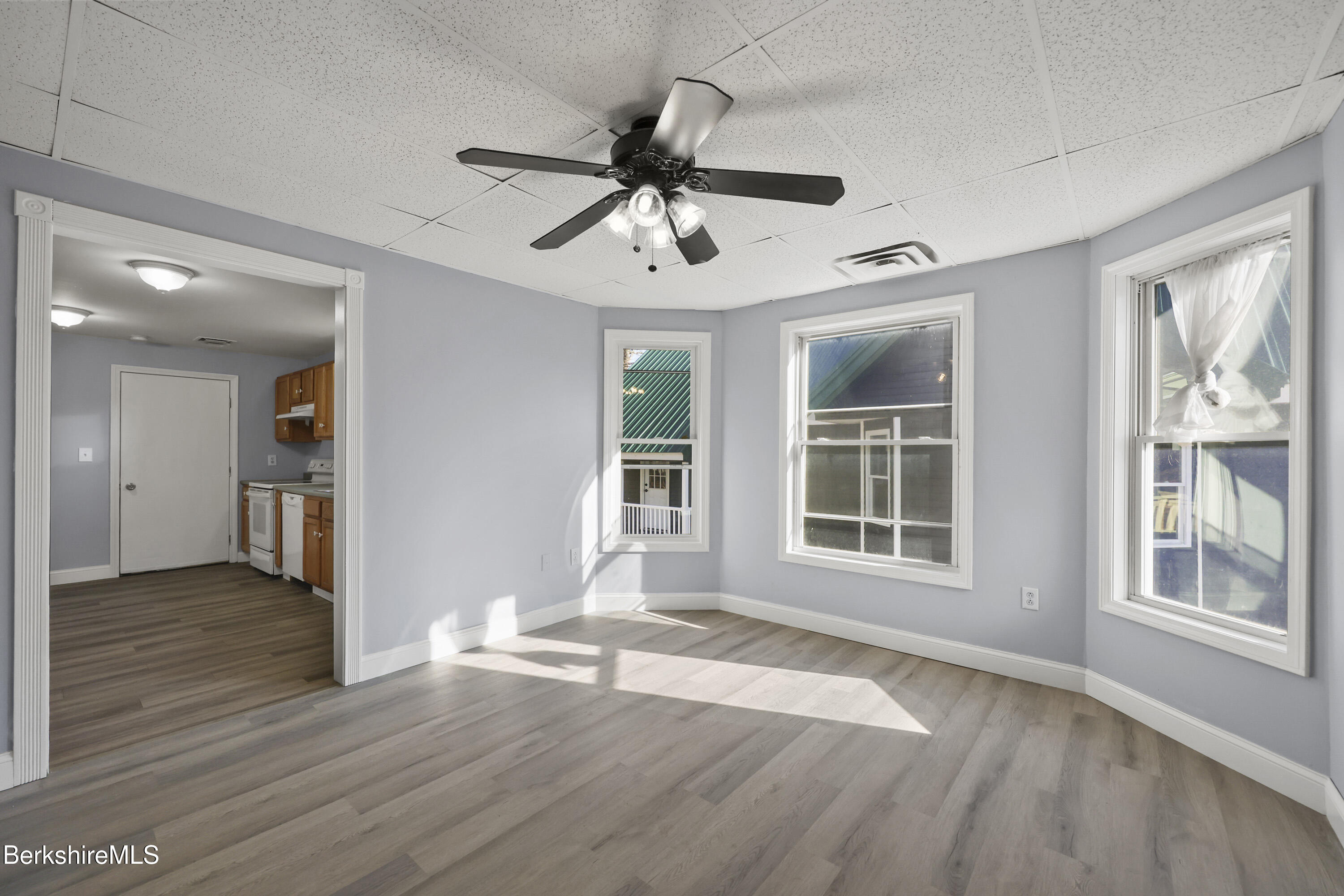 73-75 Hall Street North Adams, MA 01247 - Photo 8 of 32 a view of an empty room with wooden floor and a window