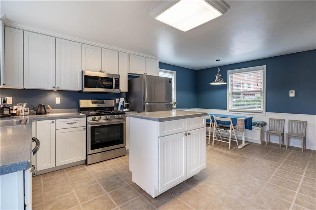 2059 Brookfield Road Pittsburgh, PA 15243 - Photo 8 of 21 The open concept kitchen is the perfect family area. Gather around the center island and enjoy cooking with the new appliances.