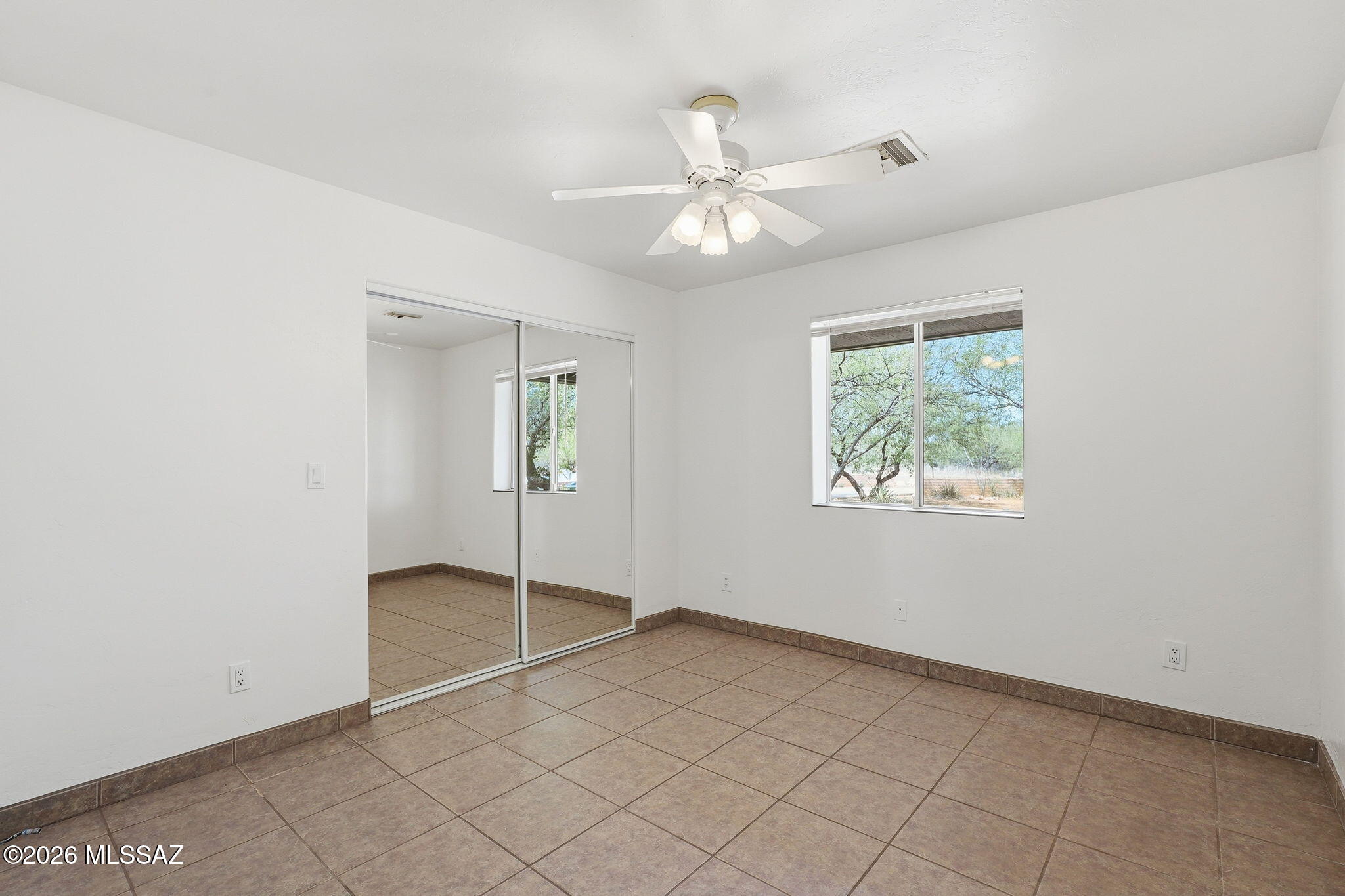 1462 Circulo Sombrero Rio Rico, AZ 85648 - Photo 35 of 50 Bedrooms 1 and 2 both look out to the front of the home. This bedrm also has mirrored closet doors.
