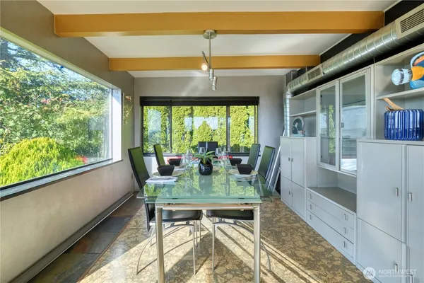 a view of a dining room with furniture window and outside view