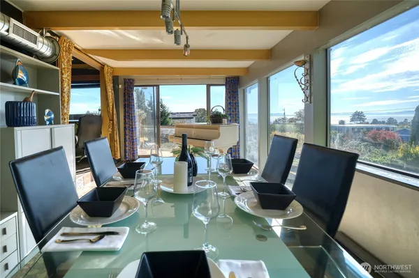 a view of a chair and tables in the patio