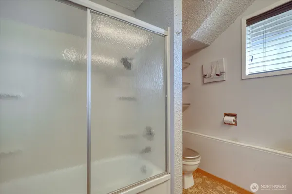 a bathroom with a sink and a window