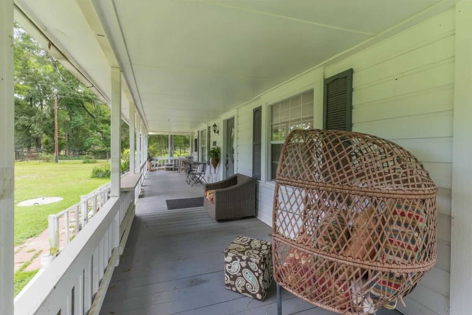 2118 Rolling Hills Road Conroe, TX 77303 - Photo 31 of 39 Classic wraparound porch invites you to slow down and savor country living.