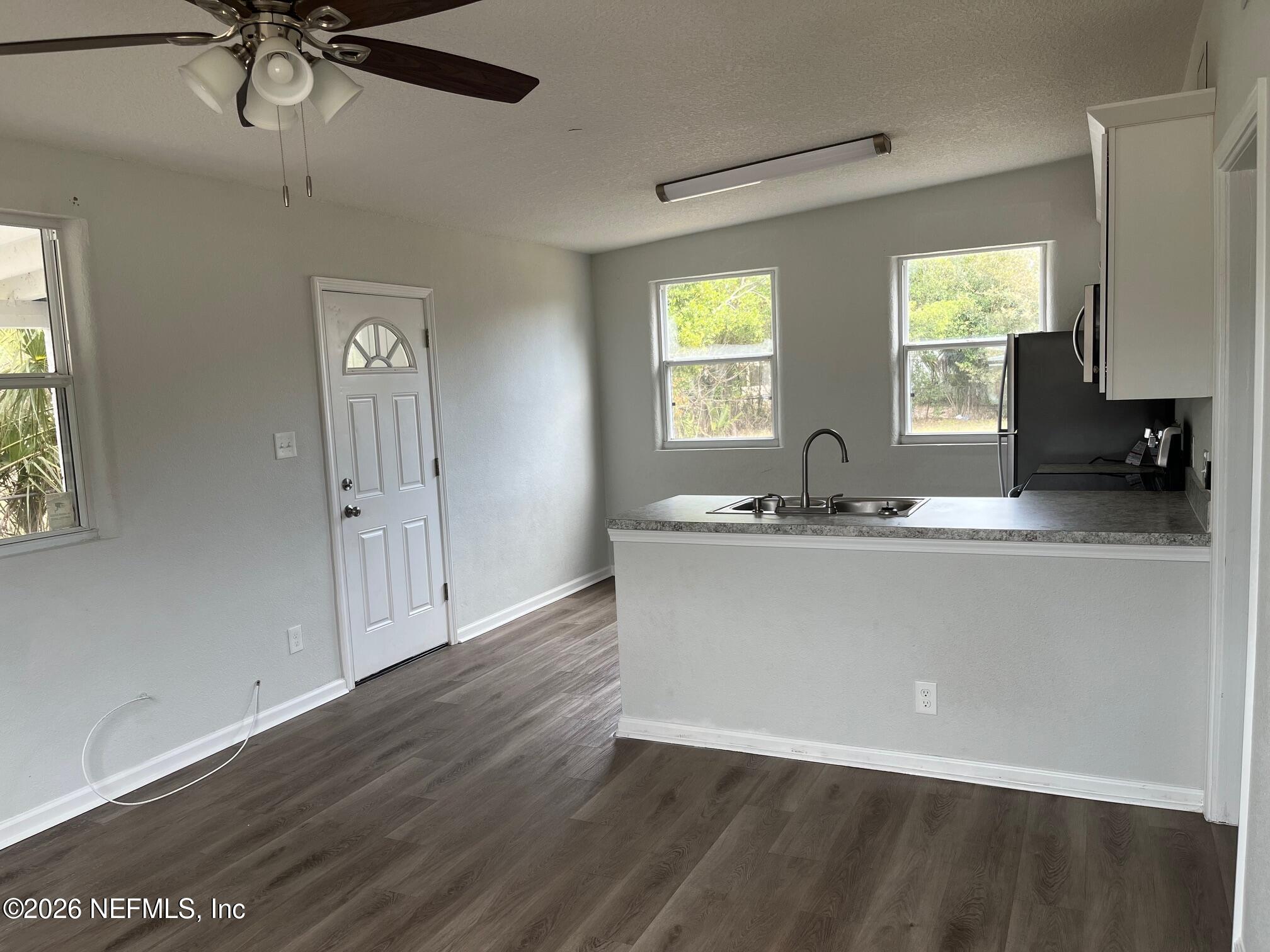 10547 Briarcliff Road East Jacksonville, FL 32218 - Photo 19 of 33 a view of a living room a window and a wooden floor