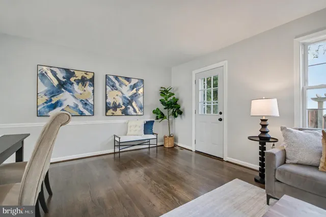 a view of a livingroom with furniture and wooden floor