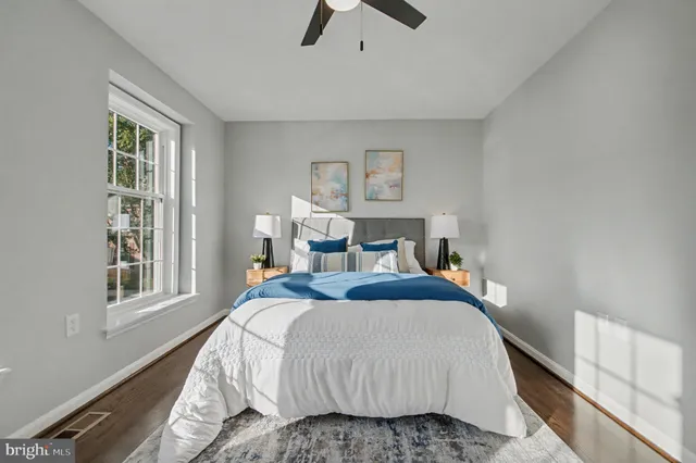 a bedroom with bed and window