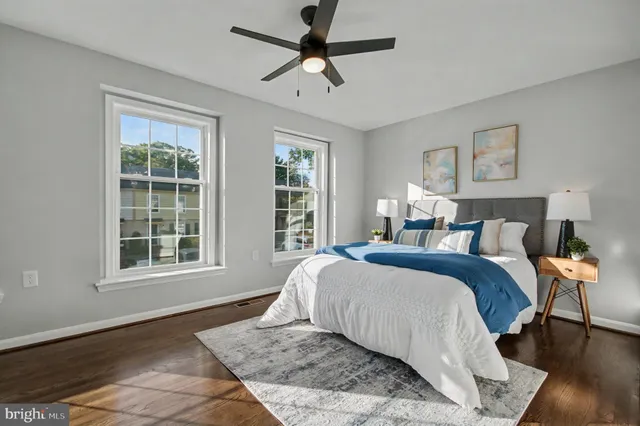 a spacious bedroom with a large bed and a window