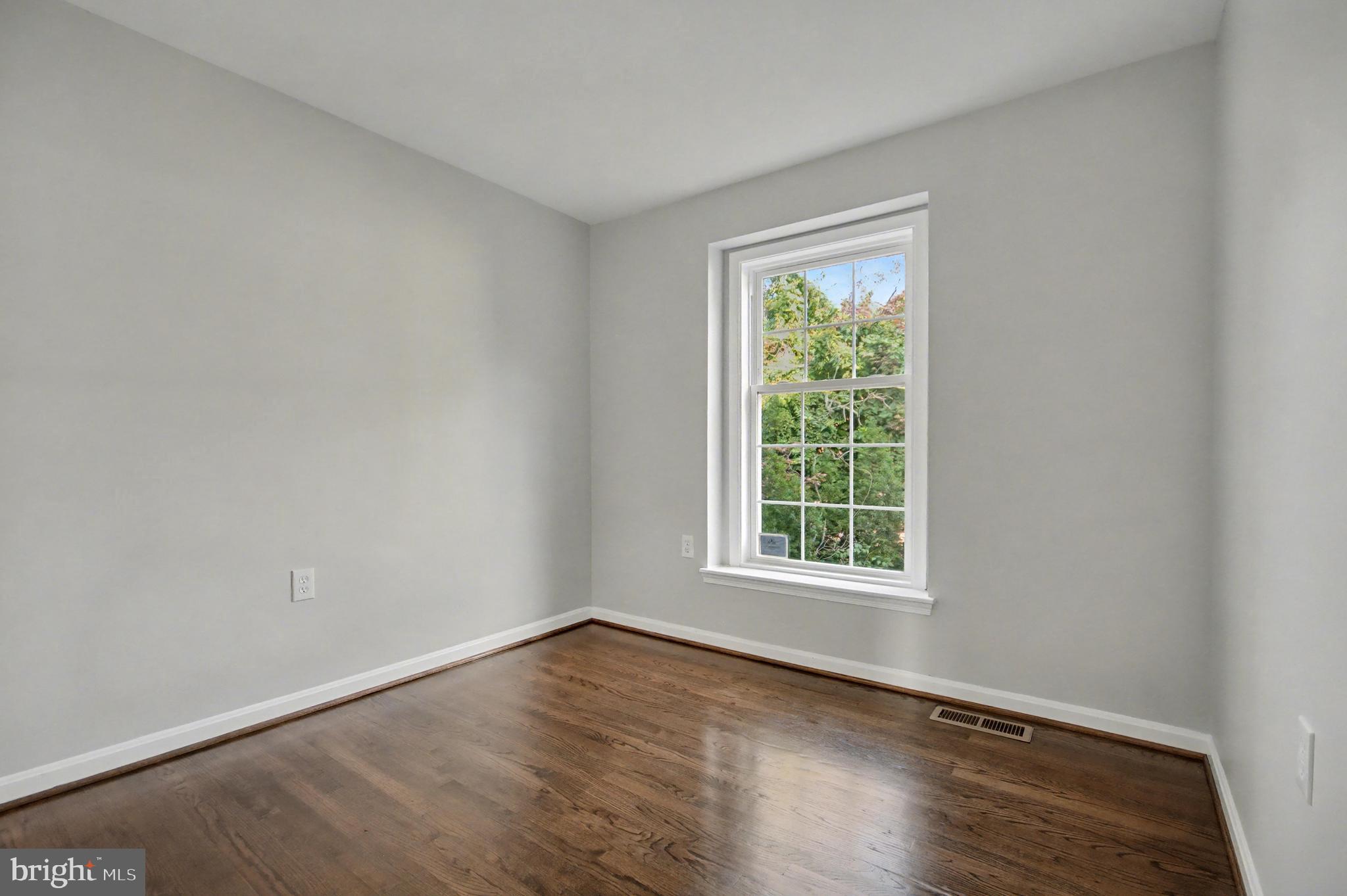 1729 Dana Street, Unit 6 Crofton, MD 21114 - Photo 25 of 33 an empty room with wooden floor and windows