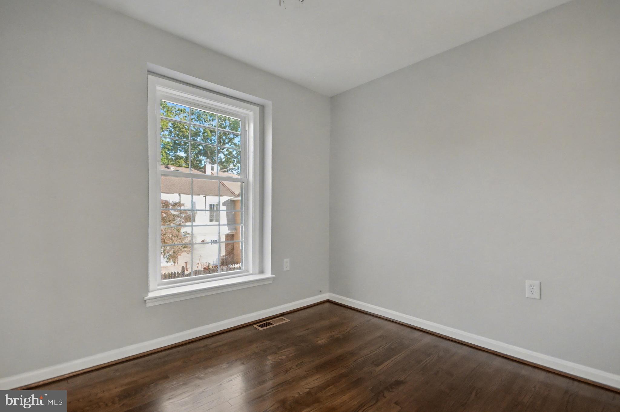 1729 Dana Street, Unit 6 Crofton, MD 21114 - Photo 27 of 33 an empty room with wooden floor and windows