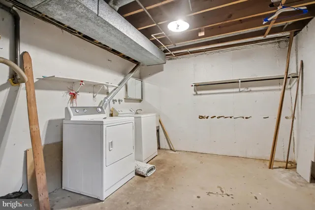 a view of a small yard with wooden fence and fence