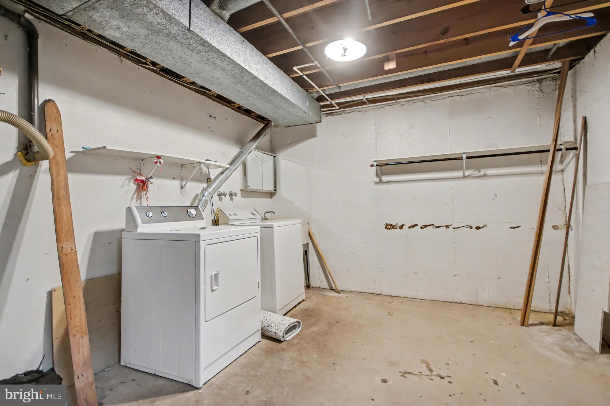 1729 Dana Street, Unit 6 Crofton, MD 21114 - Photo 31 of 33 a utility room with dryer and washer