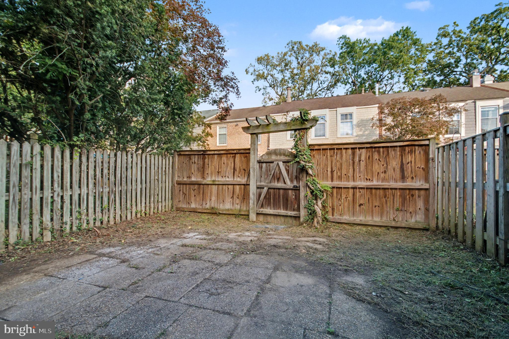 1729 Dana Street, Unit 6 Crofton, MD 21114 - Photo 32 of 33 a view of a small yard with wooden fence and fence