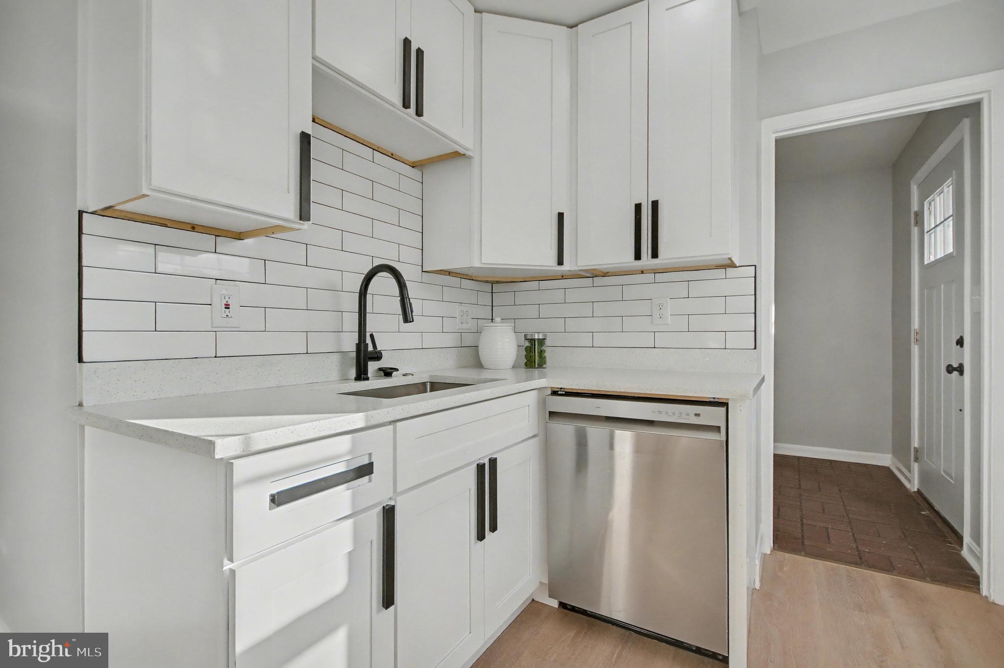 1729 Dana Street, Unit 6 Crofton, MD 21114 - Photo 5 of 33 a kitchen with white cabinets and a sink