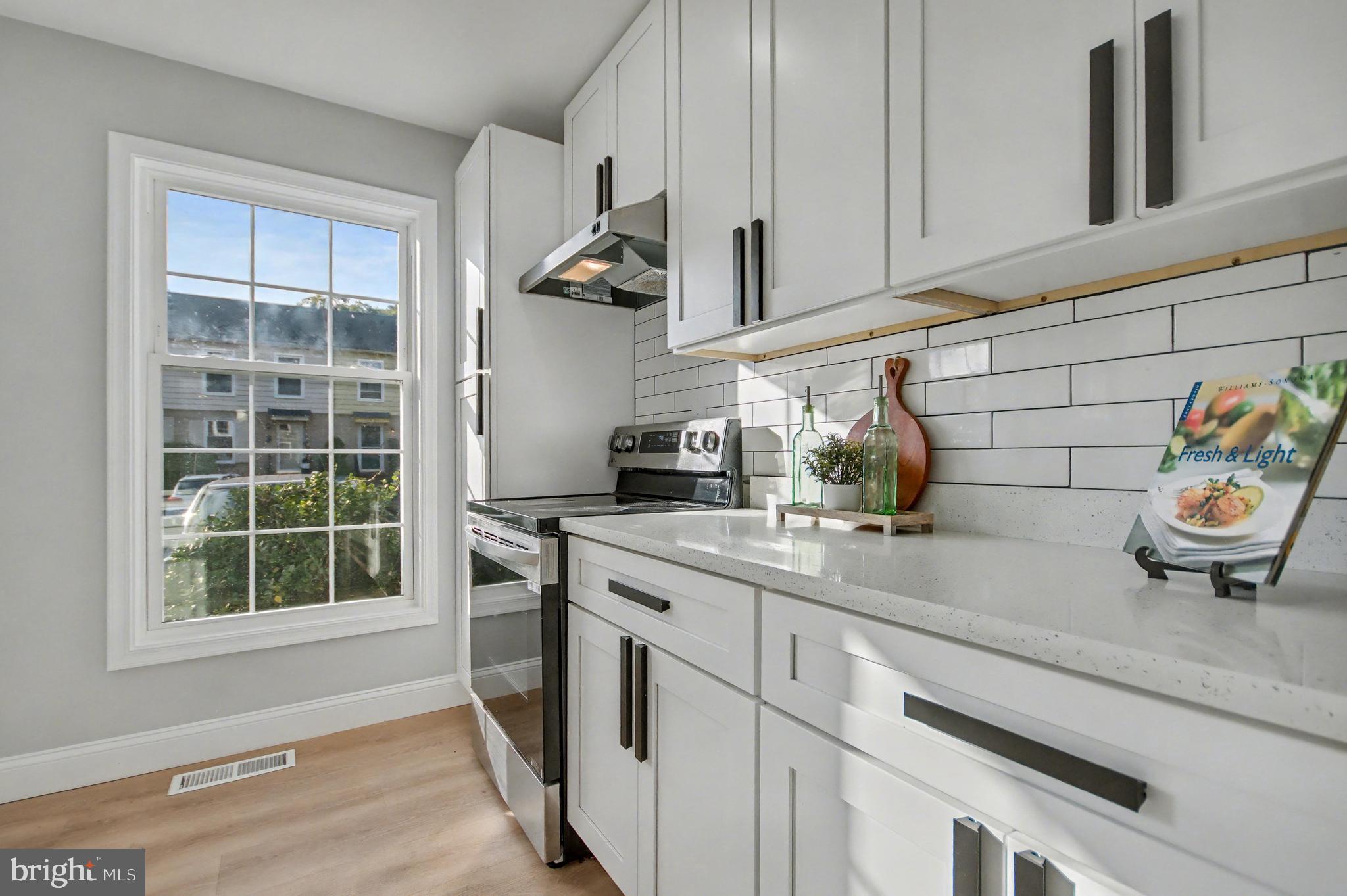 1729 Dana Street, Unit 6 Crofton, MD 21114 - Photo 7 of 33 a kitchen with a sink and cabinets