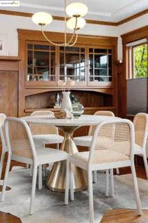 a dining area with furniture and window
