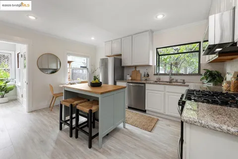 a kitchen with a sink cabinets and window