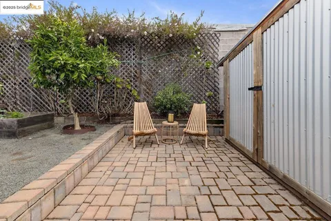 a view of a backyard with sitting area