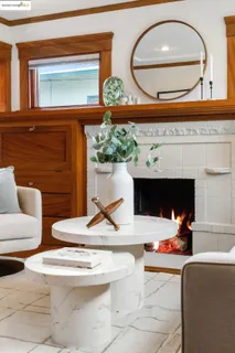 a outdoor living room with furniture and a fireplace