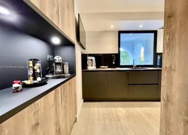 1 Rue Rolland Garros Aix Liverpool, England 13090 - Photo 22 of 31 a kitchen with stainless steel appliances kitchen island sink stove and refrigerator