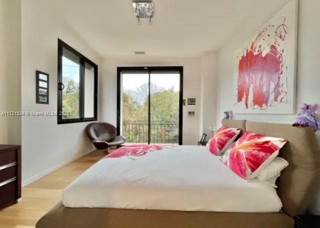 1 Rue Rolland Garros Aix Liverpool, England 13090 - Photo 25 of 31 a bedroom with a bed and a large window