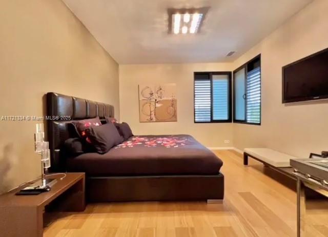 1 Rue Rolland Garros Aix Liverpool, England 13090 - Photo 26 of 31 a bedroom with a bed and flat screen tv