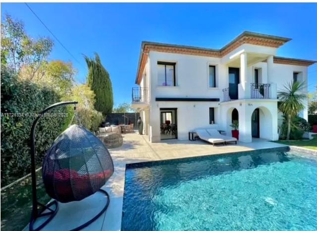 1 Rue Rolland Garros Aix Liverpool, England 13090 - Photo 4 of 31 a view of a house with backyard and sitting area
