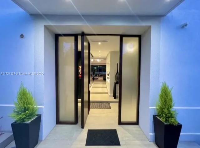 1 Rue Rolland Garros Aix Liverpool, England 13090 - Photo 5 of 31 a hallway with potted plants in front of door