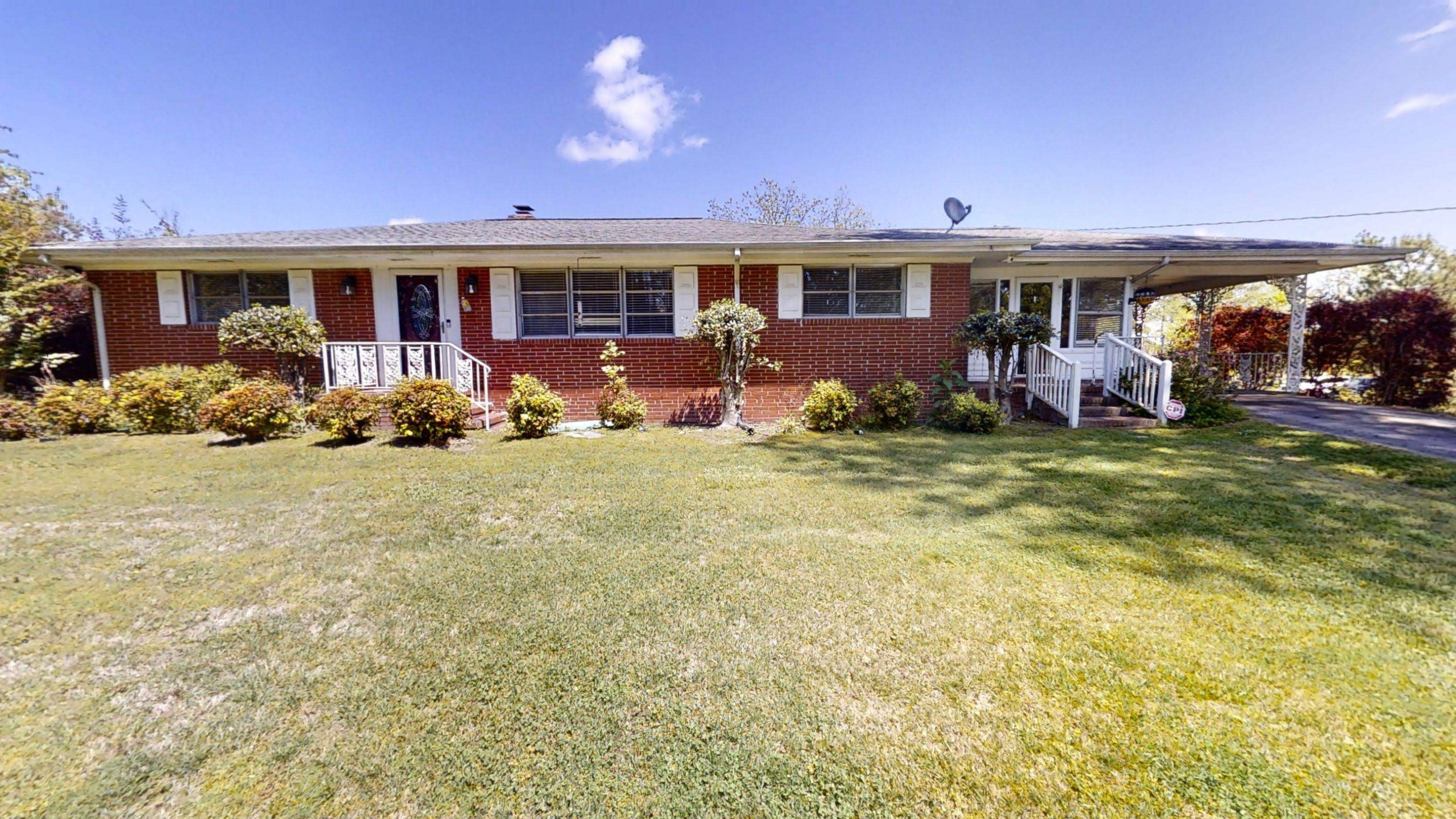 1115 Perry Road Zebulon, NC 27597 - Photo 1 of 37 a front view of house with yard and green space