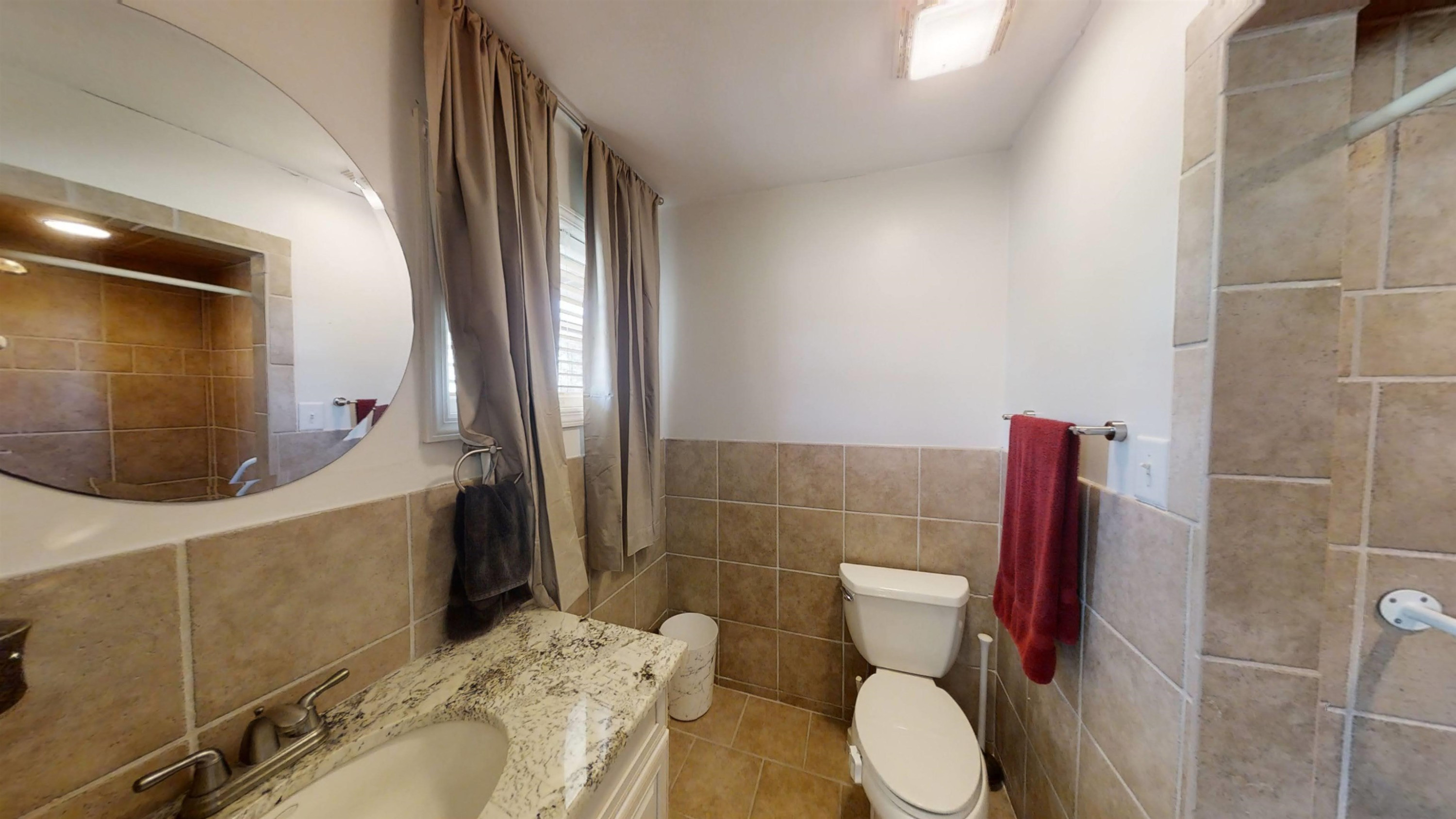 1115 Perry Road Zebulon, NC 27597 - Photo 11 of 37 a bathroom with a toilet and a mirror