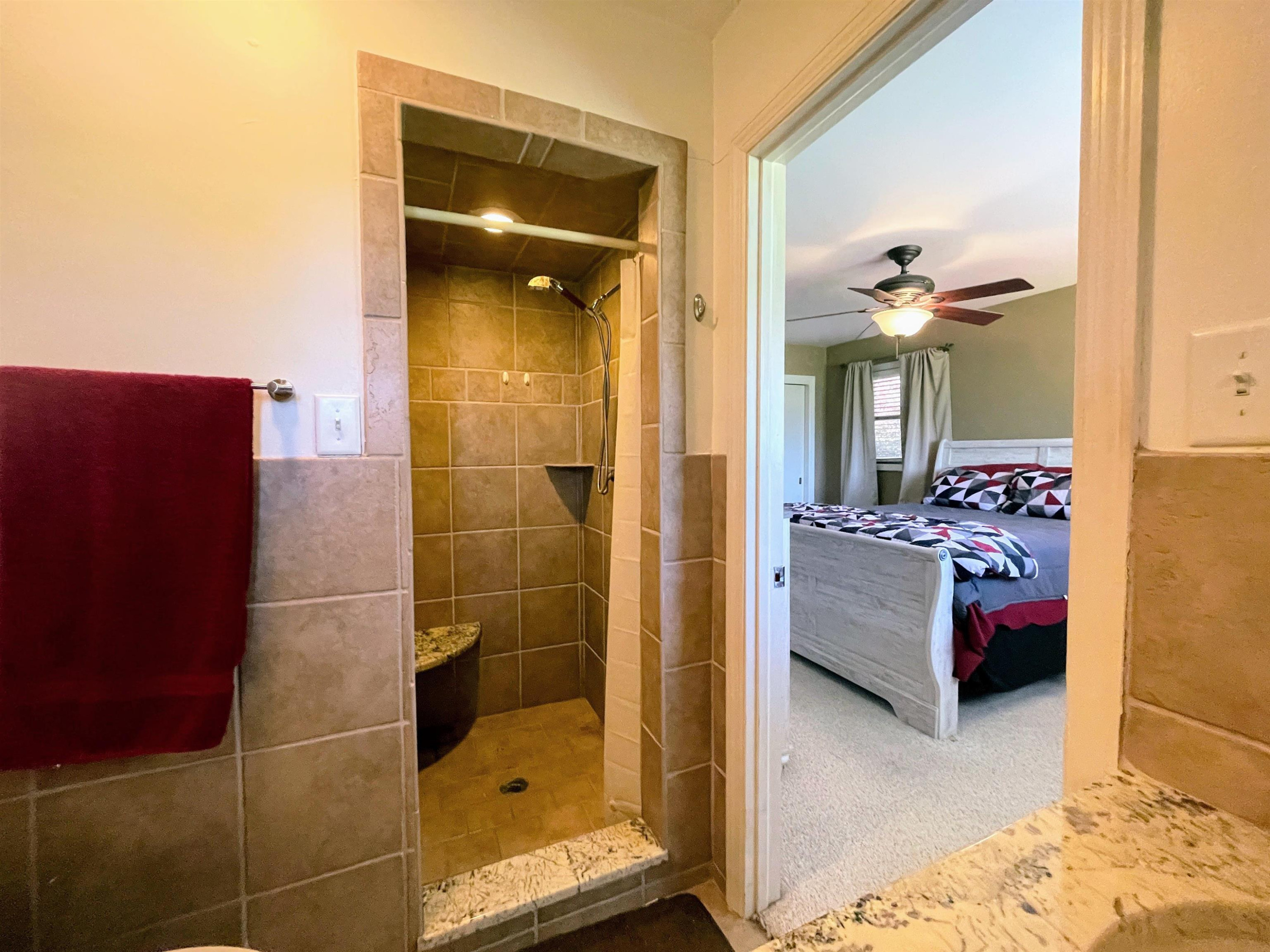 1115 Perry Road Zebulon, NC 27597 - Photo 12 of 37 a en suite bathroom with a shower and a bath tub