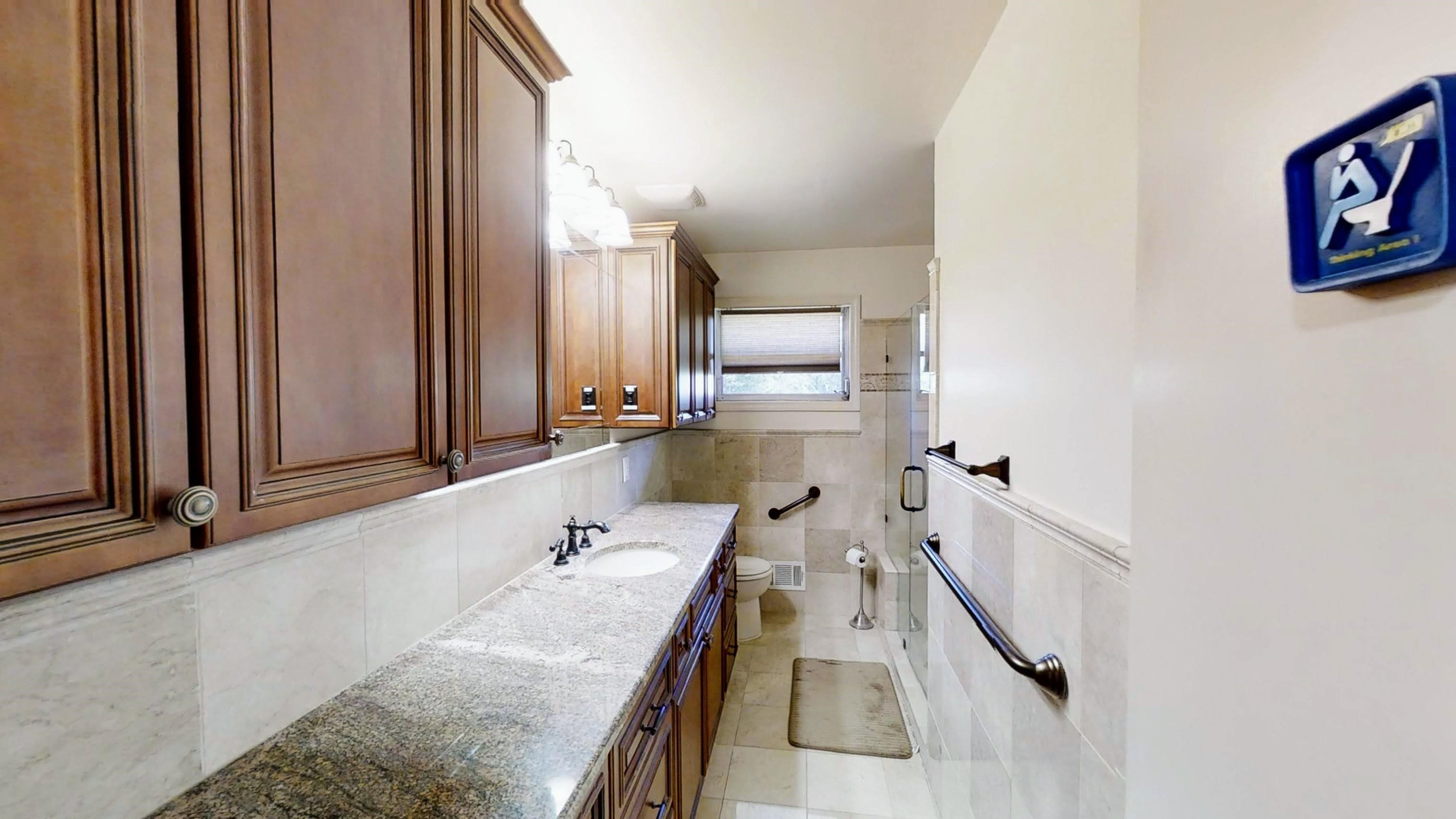 1115 Perry Road Zebulon, NC 27597 - Photo 17 of 37 a bathroom with a granite countertop tub sink and mirror