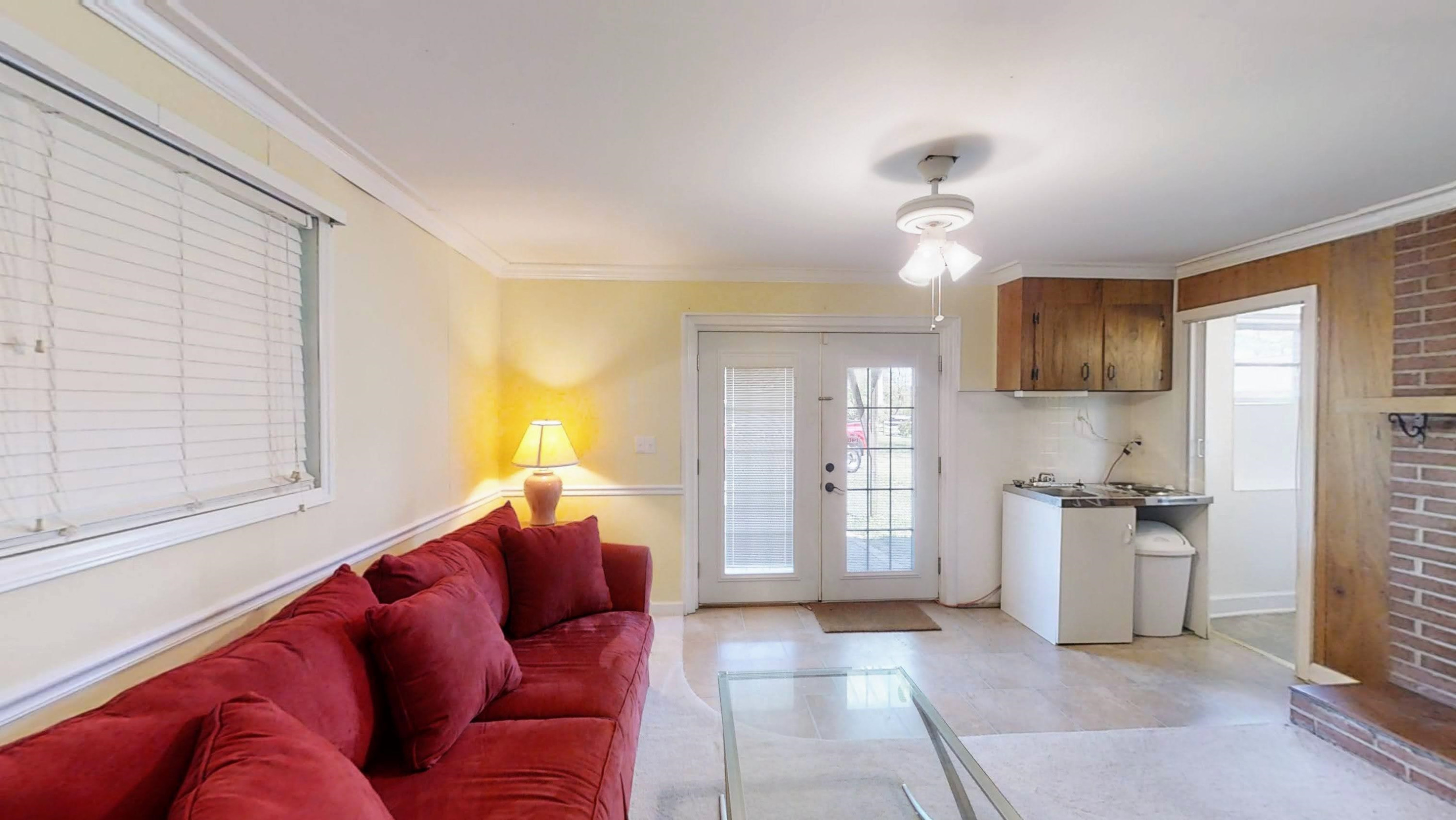 1115 Perry Road Zebulon, NC 27597 - Photo 24 of 37 a living room with furniture and a window
