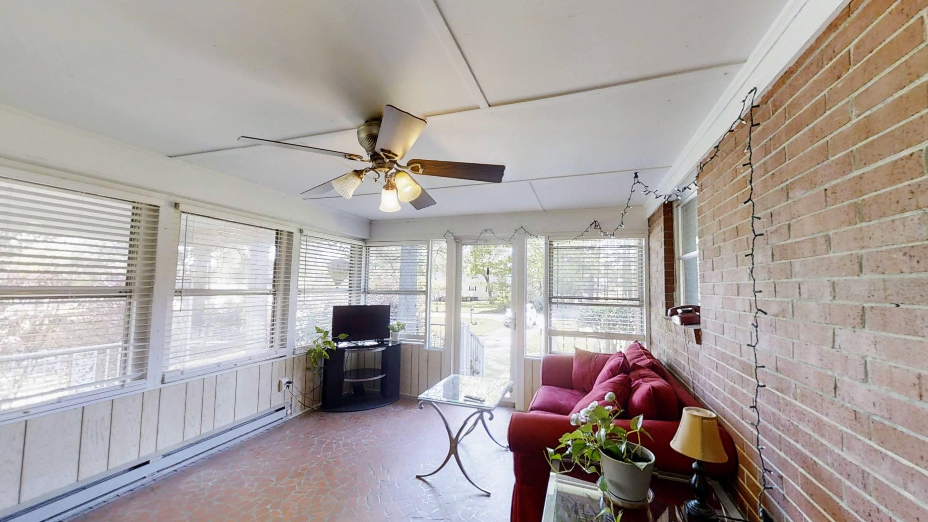 1115 Perry Road Zebulon, NC 27597 - Photo 28 of 37 a living room with furniture and a window